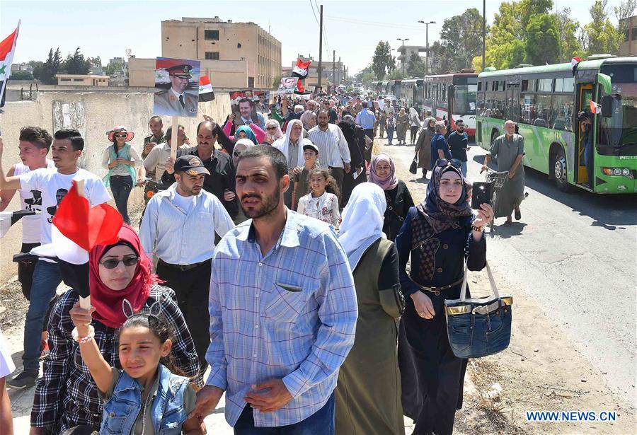 SYRIA-HOMS-CIVILIANS-RETURNING HOME