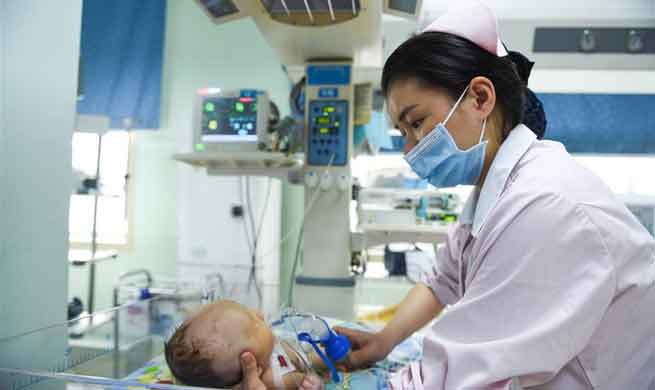 Doctors, nurses of neonatology department on call during Spring Festival in SW China