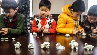 Children mould flour goats to greet Lantern Festival in E China